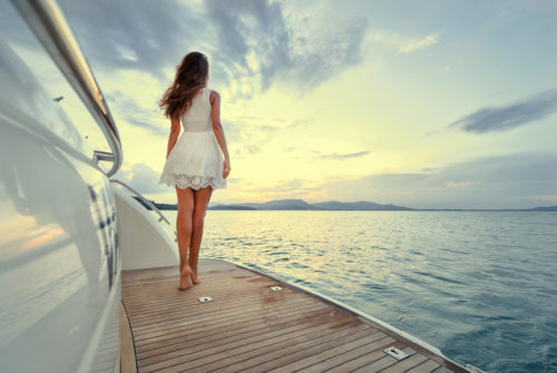 Luxury,Travel,On,The,Yacht.,Young,Woman,Enjoying,The,Sunset